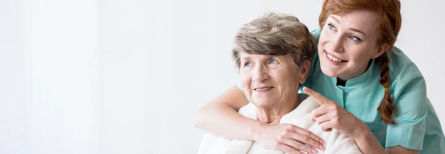 Carer and older woman at home